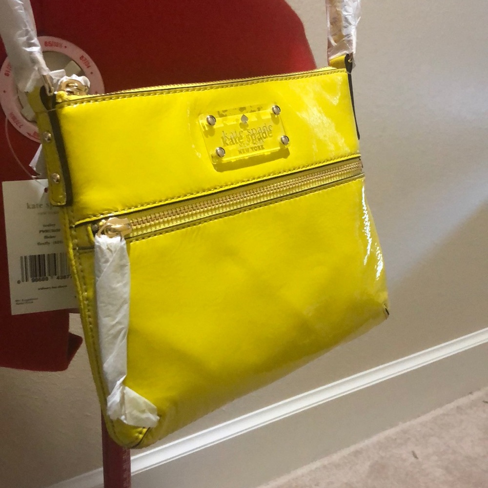 Yellow Kate spade cross body purse.